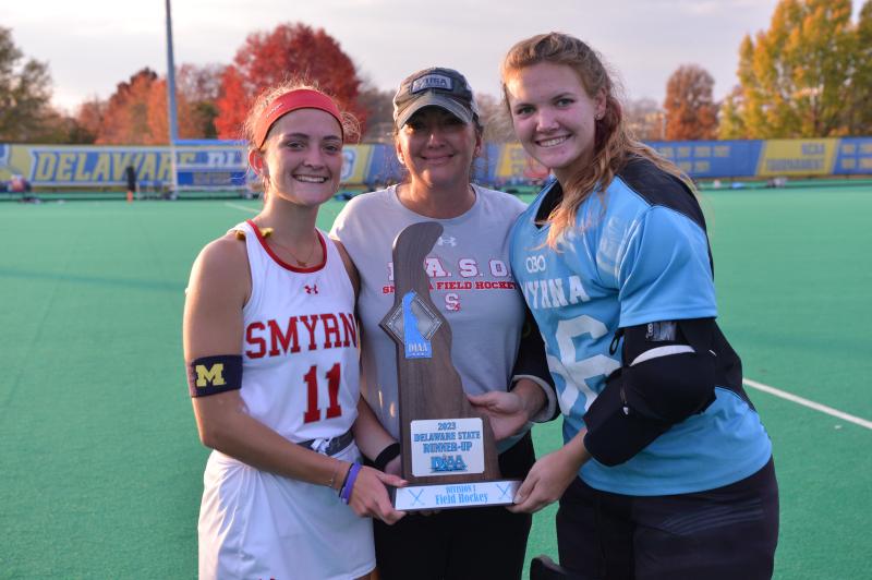 Smyrna coach Loveita Moffett is flanked by players Dru Moffett and Halle Geiger. DAVE FREDERICK PHOTO